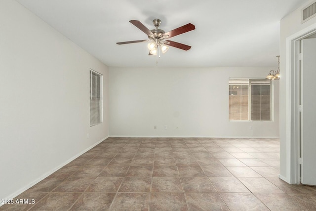21621 N 48th Pl, Phoenix, AZ 85054 - empty room with tile patterned floors, baseboards, ceiling fan with notable chandelier, and visible vents