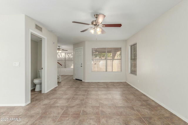 21621 N 48th Pl, Phoenix, AZ 85054 - unfurnished room with visible vents, baseboards, stairway, a ceiling fan, and light tile patterned floors