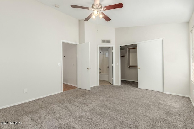 21621 N 48th Pl, Phoenix, AZ 85054 - unfurnished bedroom with carpet flooring, baseboards, vaulted ceiling, visible vents, and a closet