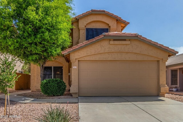 21621 N 48th Pl, Phoenix, AZ 85054 - mediterranean / spanish-style home featuring a garage, stucco siding, a tile roof, and concrete driveway