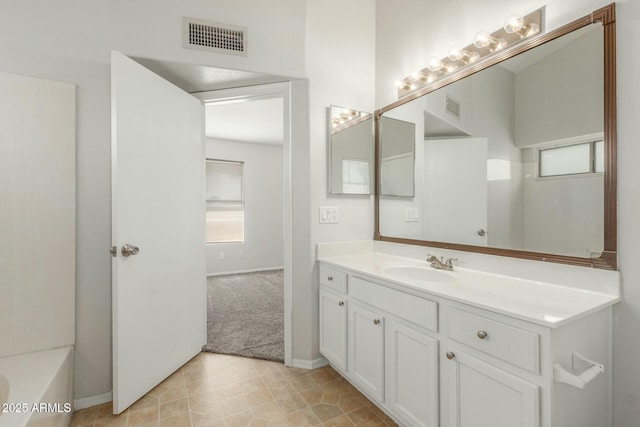 21621 N 48th Pl, Phoenix, AZ 85054 - bathroom with visible vents, baseboards, and vanity