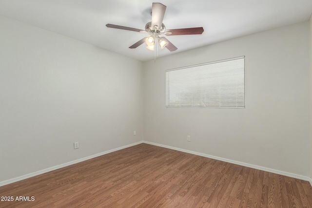 21621 N 48th Pl, Phoenix, AZ 85054 - spare room with baseboards, ceiling fan, and light wood-type flooring