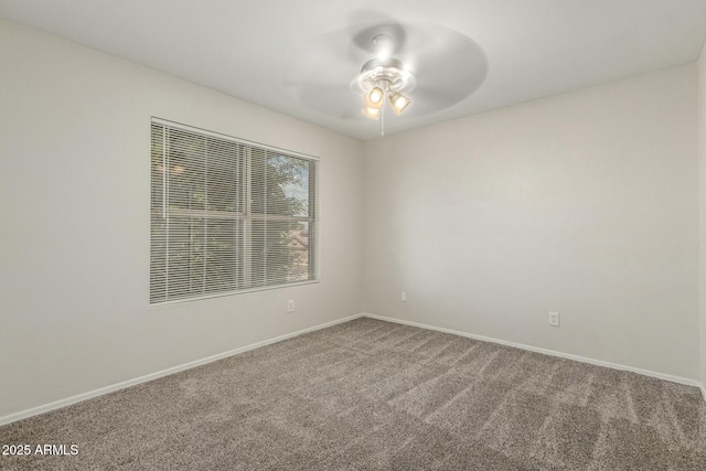 21621 N 48th Pl, Phoenix, AZ 85054 - empty room featuring carpet floors, baseboards, and ceiling fan