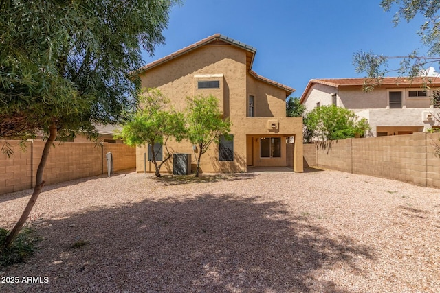 21621 N 48th Pl, Phoenix, AZ 85054 - rear view of property featuring a fenced backyard, a patio, and stucco siding