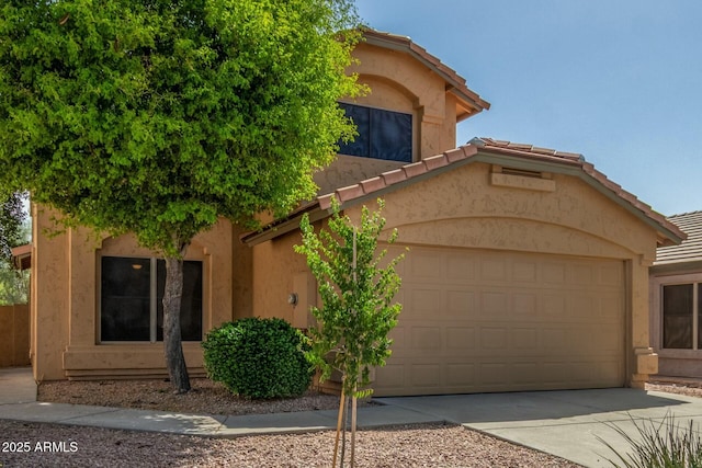 21621 N 48th Pl, Phoenix, AZ 85054 - mediterranean / spanish home featuring stucco siding, driveway, a tile roof, and a garage