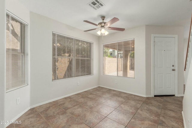 21621 N 48th Pl, Phoenix, AZ 85054 - tiled empty room with visible vents, baseboards, and ceiling fan