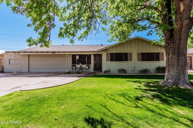 single story home with a garage, a front lawn, and brick siding