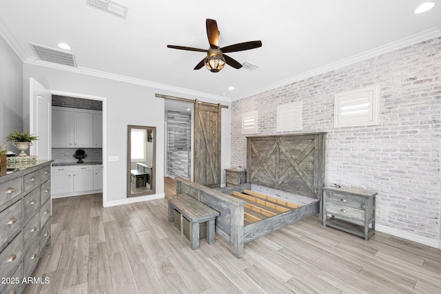 1167 E Knightsbridge Way, Gilbert, AZ 85297 - bedroom featuring brick wall, a barn door, and visible vents