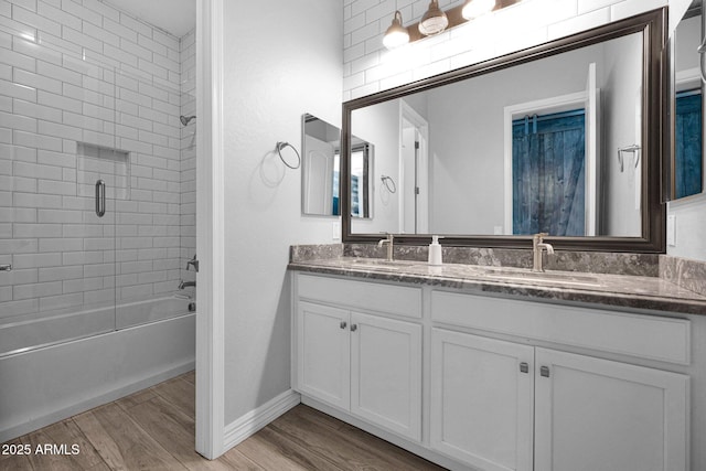 1167 E Knightsbridge Way, Gilbert, AZ 85297 - bathroom with double vanity,  shower combination, a sink, and wood finished floors