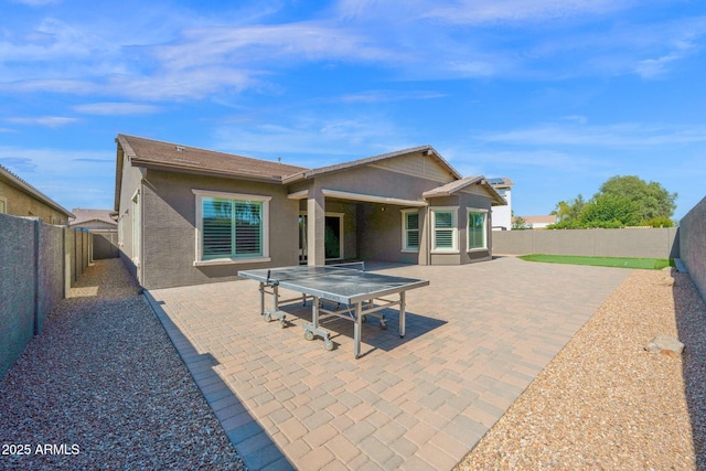 1167 E Knightsbridge Way, Gilbert, AZ 85297 - back of house featuring a fenced backyard, a patio area, and stucco siding