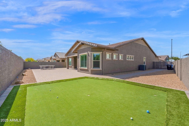 1167 E Knightsbridge Way, Gilbert, AZ 85297 - back of house with a fenced backyard, a patio, stucco siding, and central AC unit