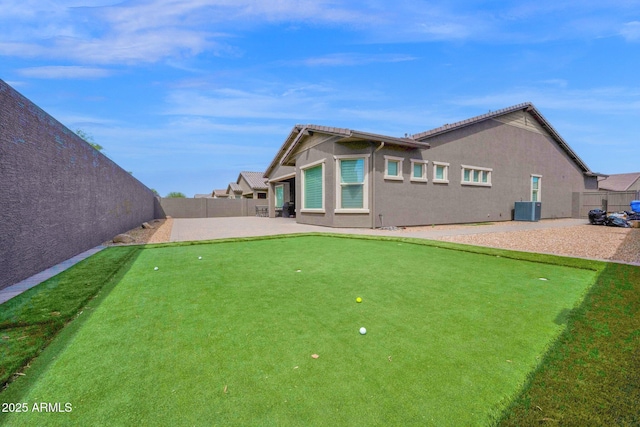 1167 E Knightsbridge Way, Gilbert, AZ 85297 - rear view of house featuring stucco siding, central AC unit, a patio area, and a fenced backyard