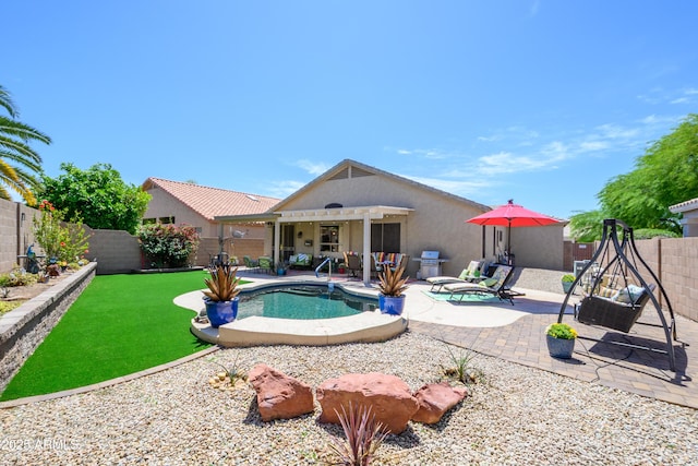 view of swimming pool with grilling area, a fenced in pool, a fenced backyard, and a patio area