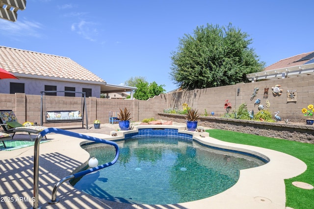 view of swimming pool with a patio, a fenced in pool, and a fenced backyard