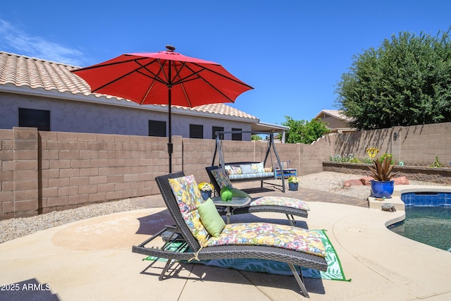 view of patio with a fenced in pool and a fenced backyard