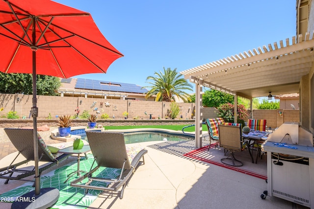 view of patio / terrace featuring a fenced in pool, a ceiling fan, outdoor dining space, and a fenced backyard