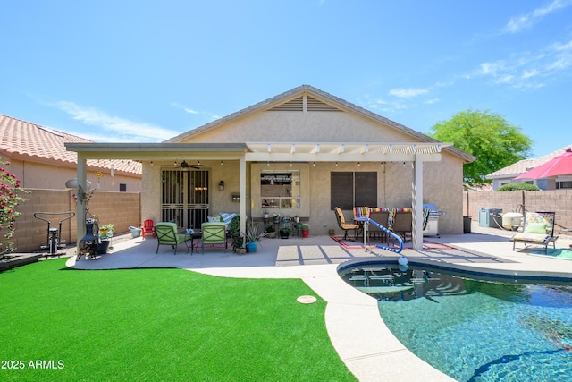back of house featuring a ceiling fan, a patio area, a fenced backyard, a pergola, and stucco siding