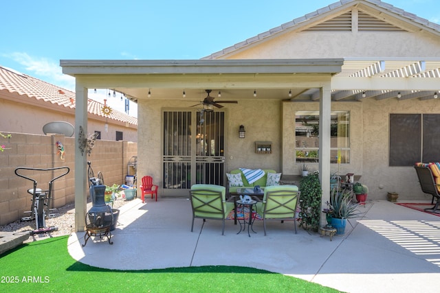 back of house with ceiling fan, fence, a patio area, and stucco siding