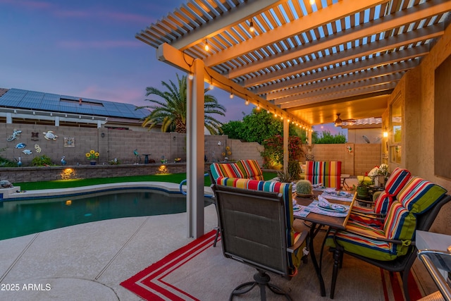 patio terrace at dusk with a pergola, a fenced in pool, a fenced backyard, and outdoor dining space