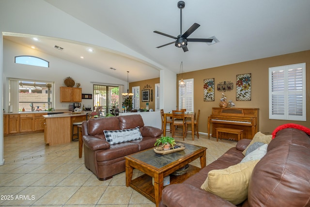 living room with visible vents, lofted ceiling, light tile patterned flooring, recessed lighting, and ceiling fan with notable chandelier
