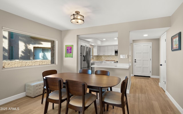 7424 N Via Camello Del Norte Unit 185, Scottsdale, AZ 85258 - dining space with light wood-style floors, recessed lighting, and baseboards