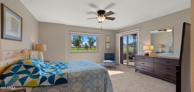 7424 N Via Camello Del Norte Unit 185, Scottsdale, AZ 85258 - bedroom with access to exterior, carpet flooring, and a ceiling fan