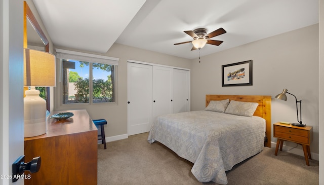 7424 N Via Camello Del Norte Unit 185, Scottsdale, AZ 85258 - bedroom featuring light colored carpet, baseboards, a closet, and a ceiling fan