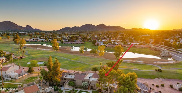 7424 N Via Camello Del Norte Unit 185, Scottsdale, AZ 85258 - aerial view at dusk of a water and mountain view, a residential view, and golf course view