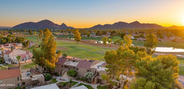 7424 N Via Camello Del Norte Unit 185, Scottsdale, AZ 85258 - aerial view at dusk of a water and mountain view, view of golf course, and a residential view