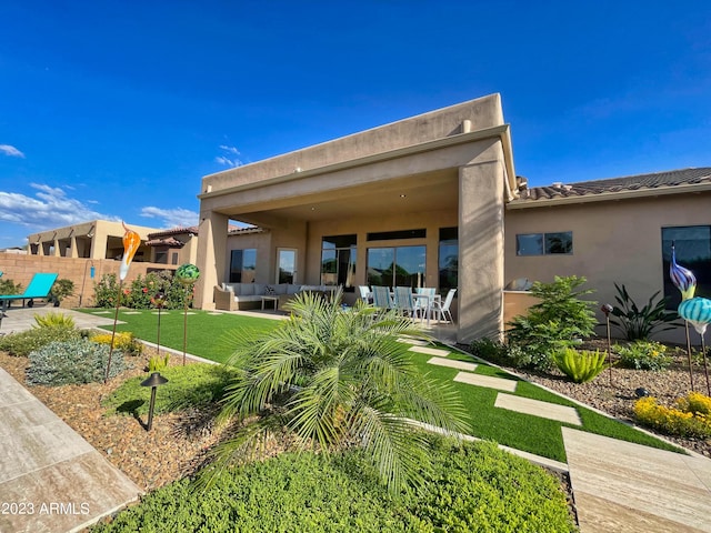 2308 E Dry Wood Rd, Phoenix, AZ 85024 - back of property featuring an outdoor living space, a patio area, and stucco siding