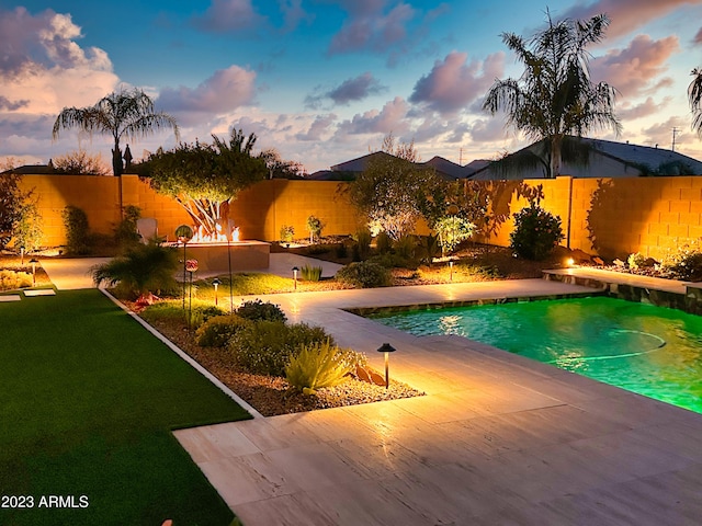 2308 E Dry Wood Rd, Phoenix, AZ 85024 - pool at dusk with a patio area