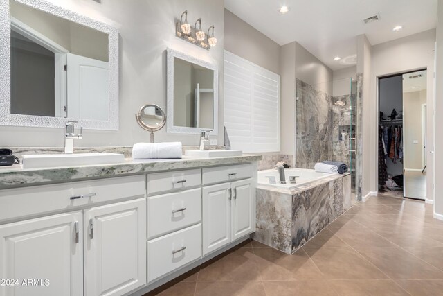 2308 E Dry Wood Rd, Phoenix, AZ 85024 - bathroom featuring tile patterned floors, a shower stall, a bath, and double vanity