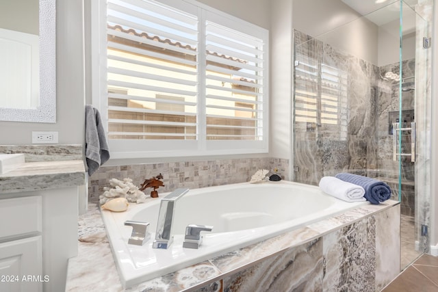 2308 E Dry Wood Rd, Phoenix, AZ 85024 - bathroom with a stall shower, vanity, and a garden tub
