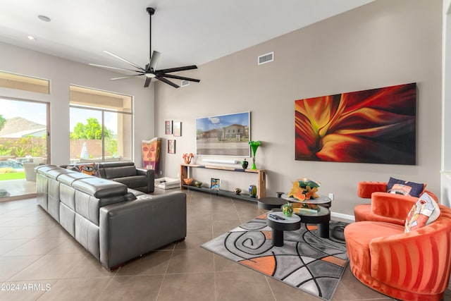 2308 E Dry Wood Rd, Phoenix, AZ 85024 - living area with tile patterned flooring, a ceiling fan, and a towering ceiling
