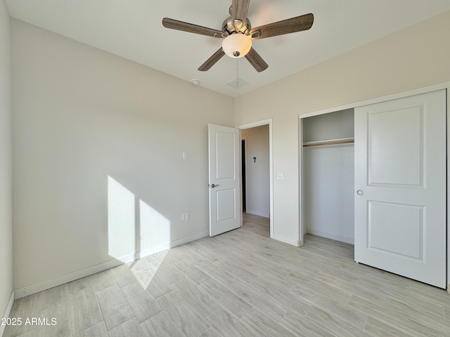 unfurnished bedroom with a closet, baseboards, light wood-style floors, and a ceiling fan