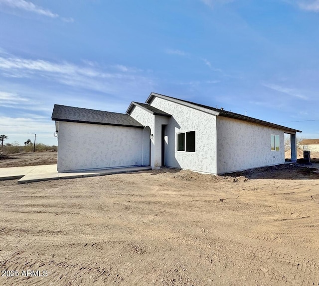 exterior space featuring stucco siding