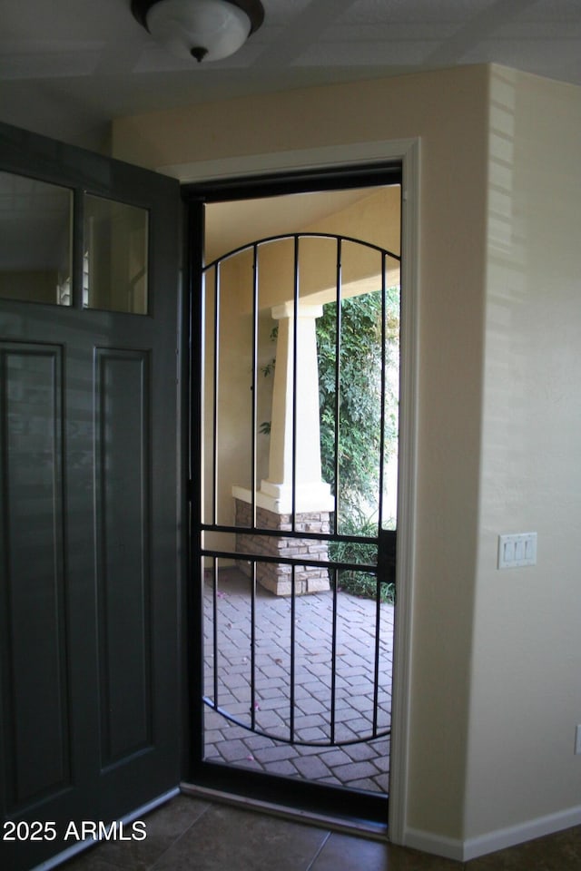 15387 W Columbine Dr, Surprise, AZ 85379 - doorway to outside featuring baseboards