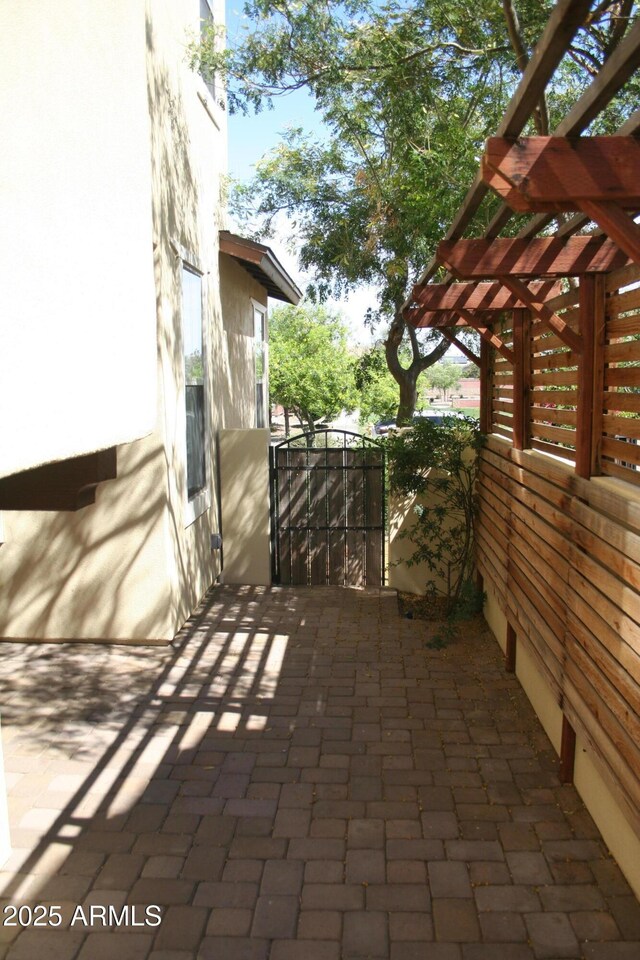 15387 W Columbine Dr, Surprise, AZ 85379 - view of patio with a gate and a pergola