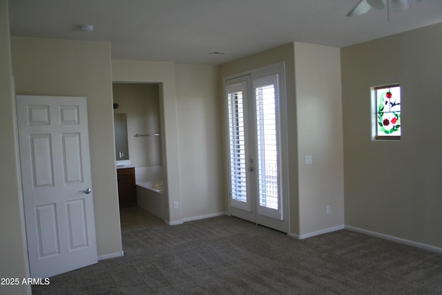 15387 W Columbine Dr, Surprise, AZ 85379 - carpeted spare room featuring baseboards and a ceiling fan