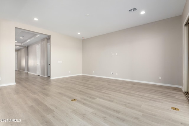 empty room with light hardwood / wood-style flooring