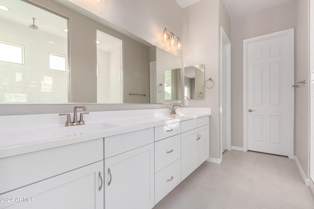 bathroom with a shower and vanity