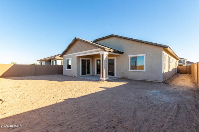 rear view of property with a patio