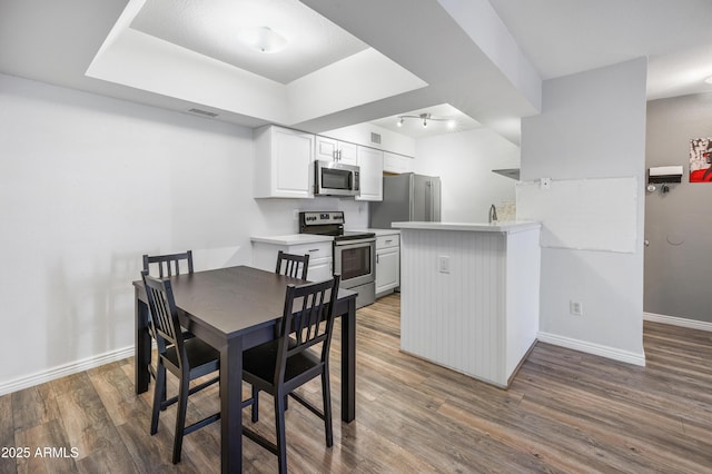 10610 S 48th St Unit 1096, Phoenix, AZ 85044 - dining space with wood finished floors and baseboards