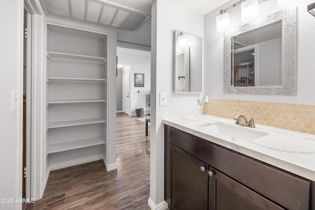 10610 S 48th St Unit 1096, Phoenix, AZ 85044 - bathroom with tasteful backsplash, wood finished floors, and vanity