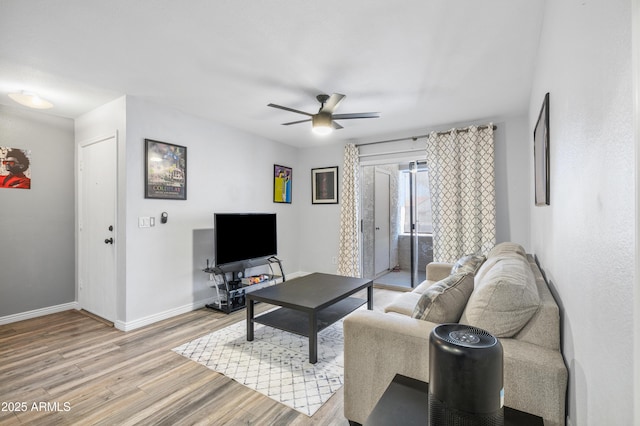 10610 S 48th St Unit 1096, Phoenix, AZ 85044 - living area with light wood-style floors and ceiling fan