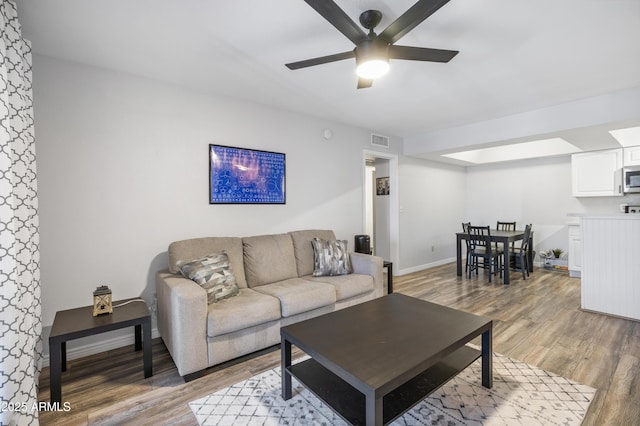 10610 S 48th St Unit 1096, Phoenix, AZ 85044 - living area featuring light wood-type flooring and a ceiling fan