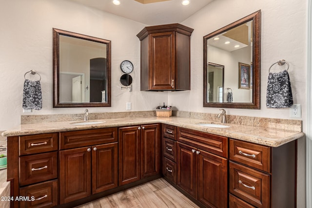 bathroom featuring hardwood / wood-style floors and vanity