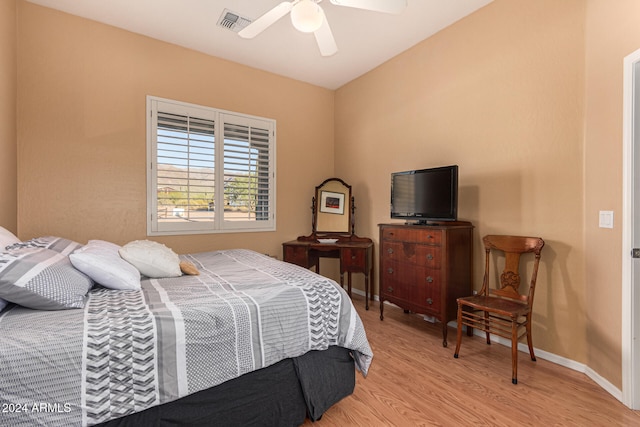 bedroom featuring light hardwood / wood-style floors and ceiling fan