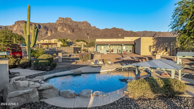 view of swimming pool with a mountain view, a gazebo, and a patio