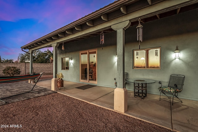 view of patio terrace at dusk